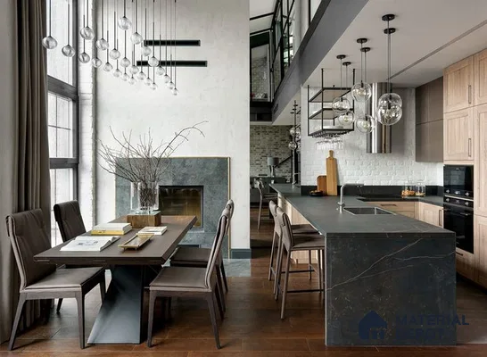 A kitchen with marble counter tops and stainless steel appliances on the wall, along with hanging lights hanging from the ceiling over the ceiling over the wall next to an island in front of a wooden floor and white